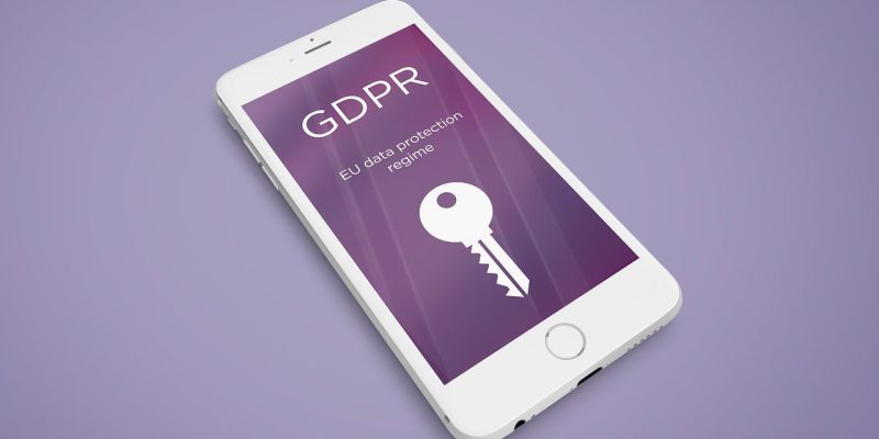 Iphone with GDPR on the screen and an image of a key